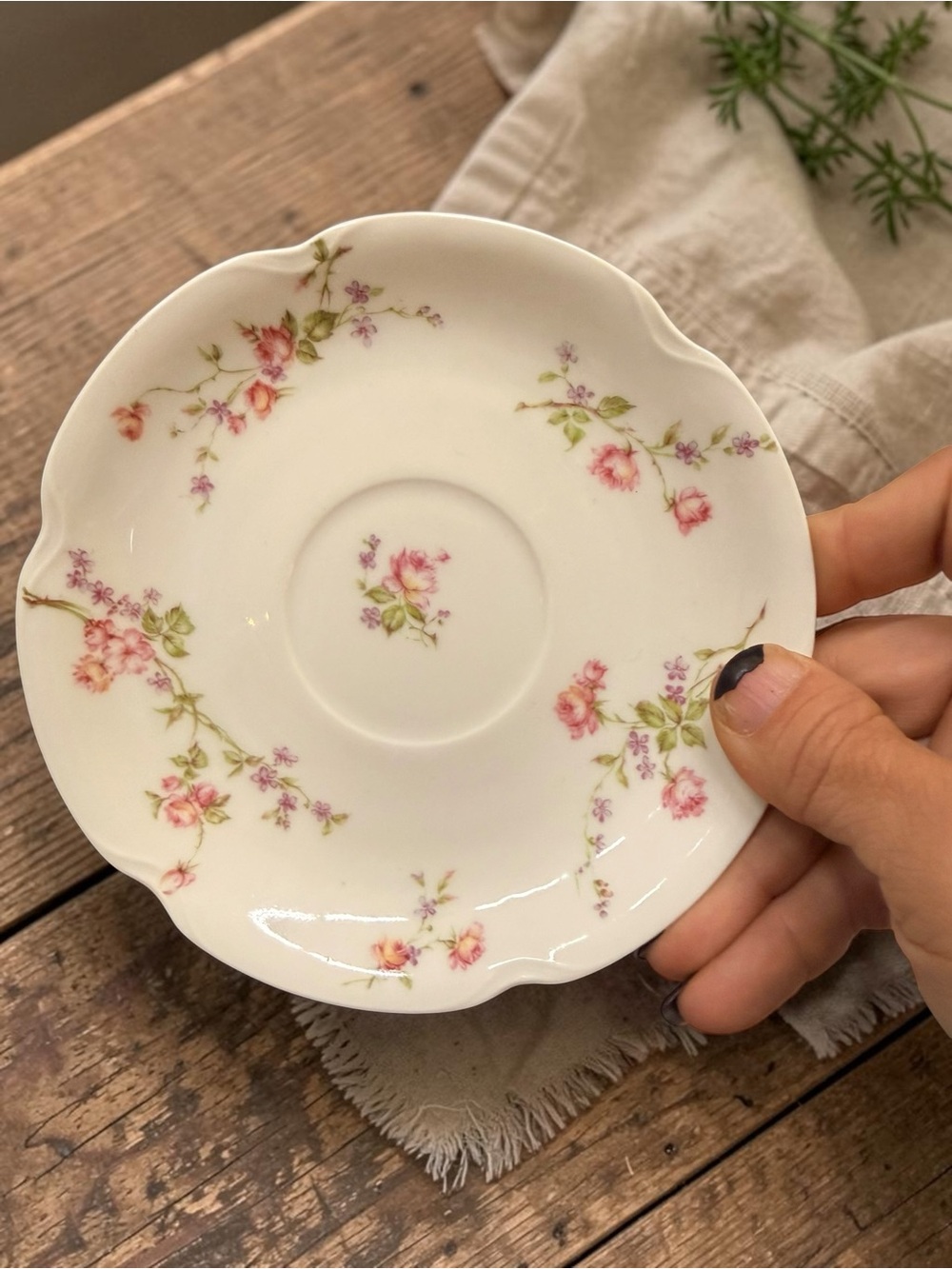 Antique Haviland & Co. Limoges porcelain saucer with floral pattern.